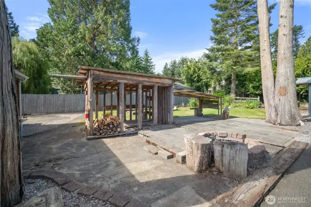 paver patio and convenient woodshed.