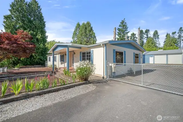 Paved driveway with gate secures your property.