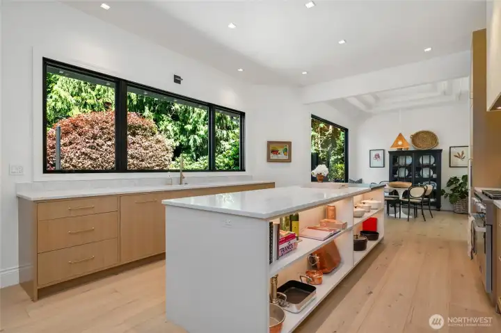 Ample drawer storage, open shelving, and sleek under-cabinet lighting for easy access to everything you could need in the kitchen!