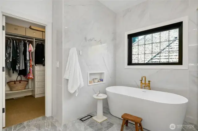 Another look at the soaking tub with natural lighting - with direct access to a spacious walk-in closet.