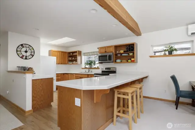 This kitchen has lots of cabinets, plenty of counter top spaces.   It's a pleasure to prepare meals in!