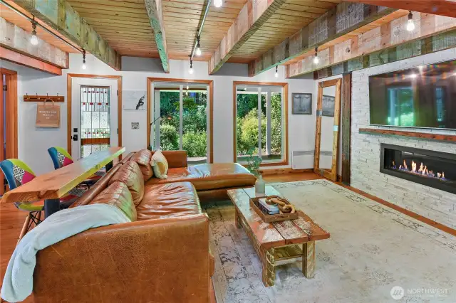 Open concept: Front entry on left. Beams are salvaged from Seattle cannery building