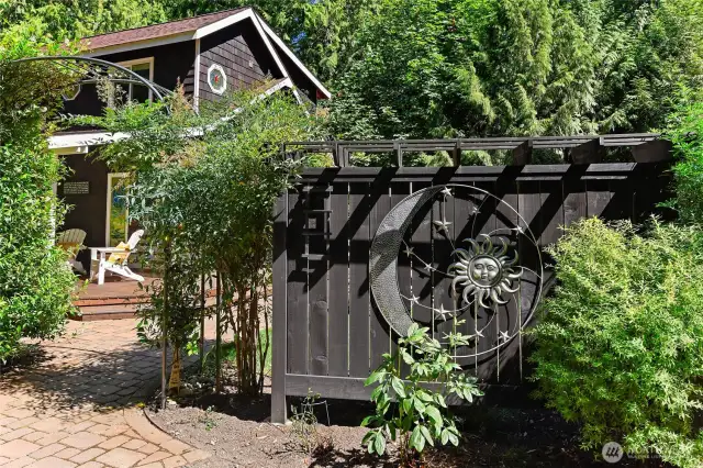 Inviting arbor offers privacy and charm