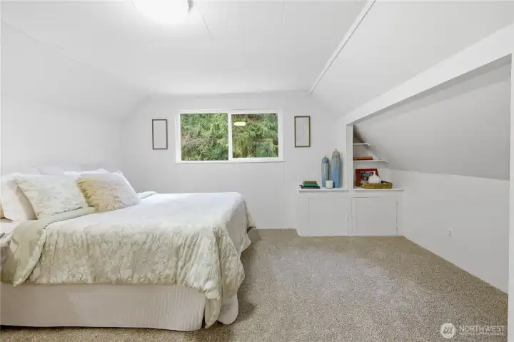 Primary bedroom with attached half bath