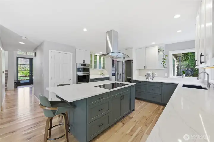 Quartz countertops and stainless steel appliances. Double ovens do it all, including steam bake.