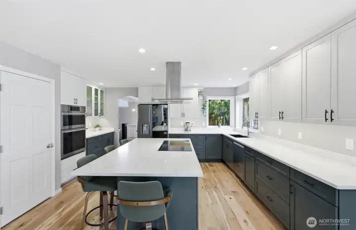 Walk-in pantry on the left has a full sized wine refrigerator, cabinets and shelves.