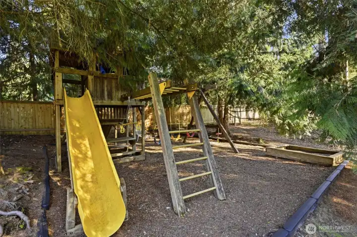 Playground for the kids - slide, picnic table, swings, bars, fort... and a sand box too!