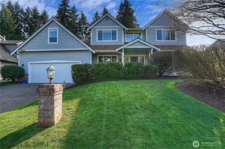 Beautifully landscaped front yard sets the stage for this inviting home, offering stunning curb appeal and a warm, welcoming first impression.