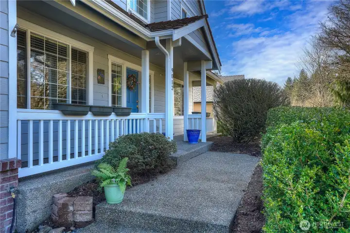 Covered front porch entry creates a warm and inviting welcome—perfect for enjoying morning coffee or greeting guests in style.