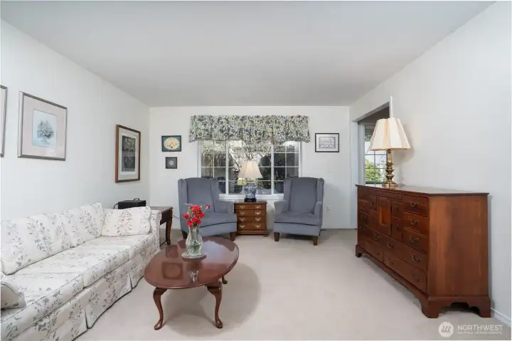 Beautiful formal living room adds a touch of sophistication, ideal for hosting or relaxing in a serene space.