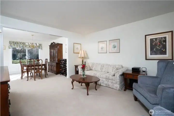 Another perspective of the formal living room showcases the open feel and natural flow of this inviting space.