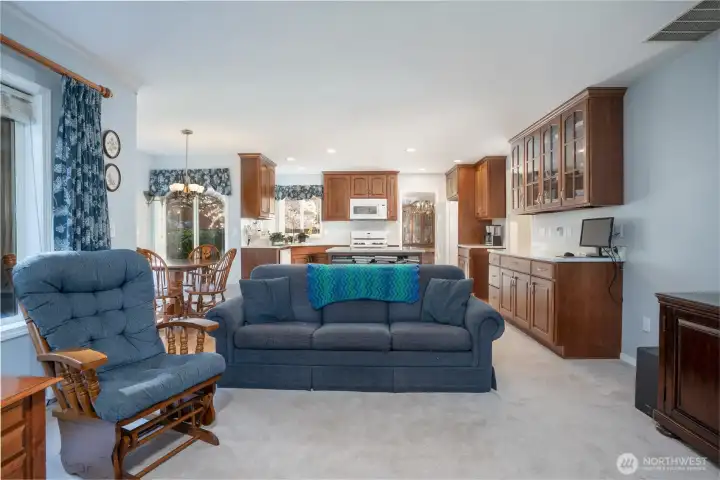 Spacious living area flows seamlessly into the kitchen, creating an open-concept layout perfect for entertaining and everyday living.