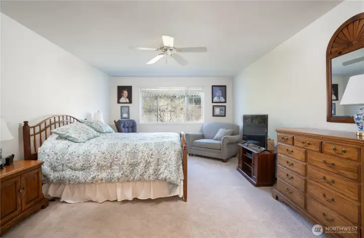 Alternate view highlights the primary suite’s generous proportions and inviting ambiance.