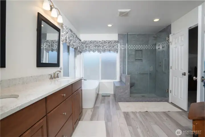 Beautifully updated primary bath features modern finishes, a spacious layout, and a serene retreat-like atmosphere.
