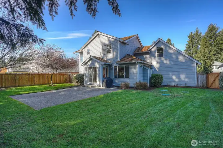 Spacious level back yard with patio, perfect for enjoying those summer days.