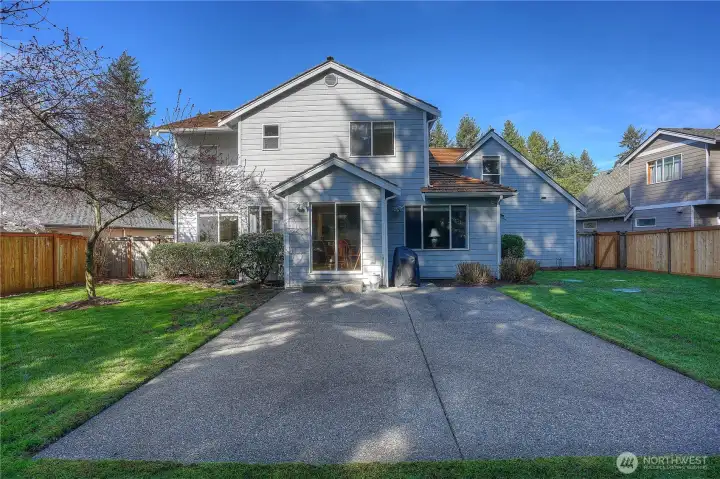 Large cement patio in backyard.