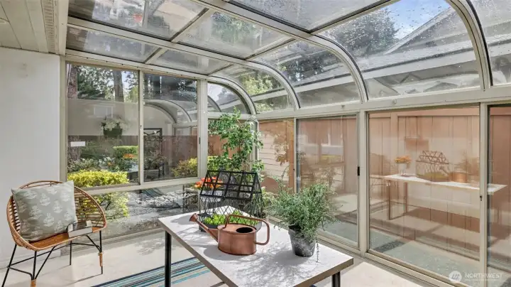 Relax with your morning coffee in this sunroom retreat
