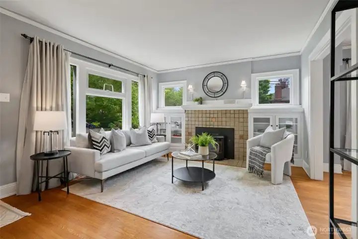 Beautifully preserved fir floors, elegant crown molding, and classic built-in cabinetry add warmth and personality