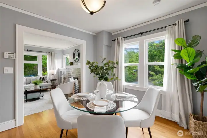 The living room flows seamlessly into a dedicated dining room