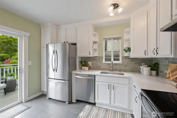 The kitchen has direct access to a generous deck, ideal for indoor-outdoor living, BBQing and entertaining