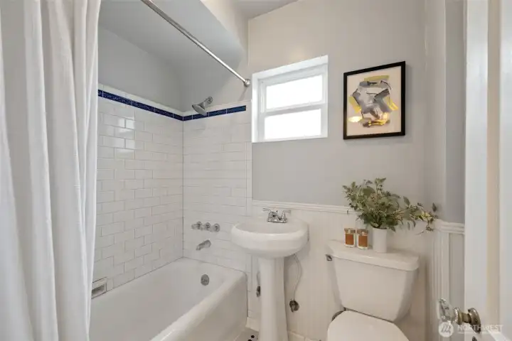 Main level full bathroom with classic charm