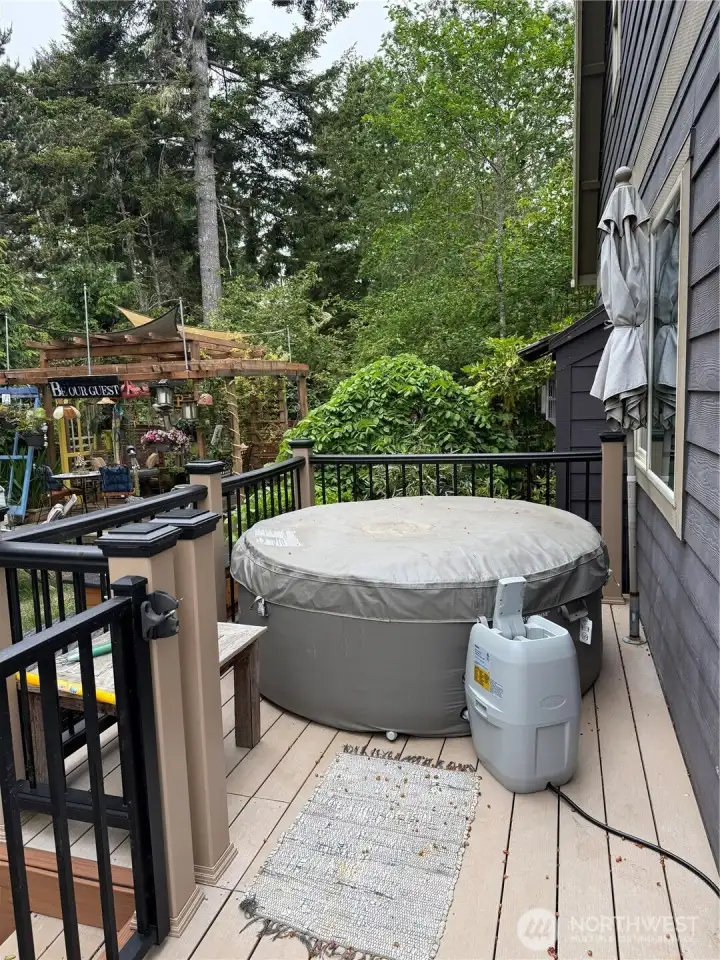 Hot tub on outside south side deck