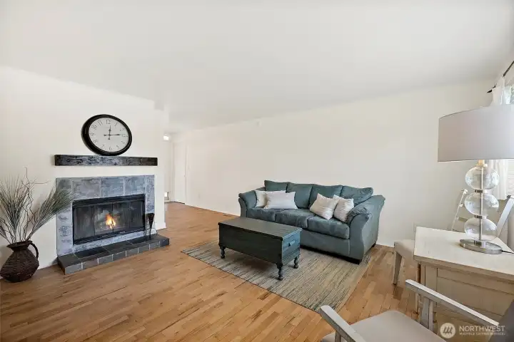View through the front door into the living room. Wood burning fireplace. 14'6" x 15'8". View through the front door into the living room. Wood burning fireplace. 14'6" x 15'8".