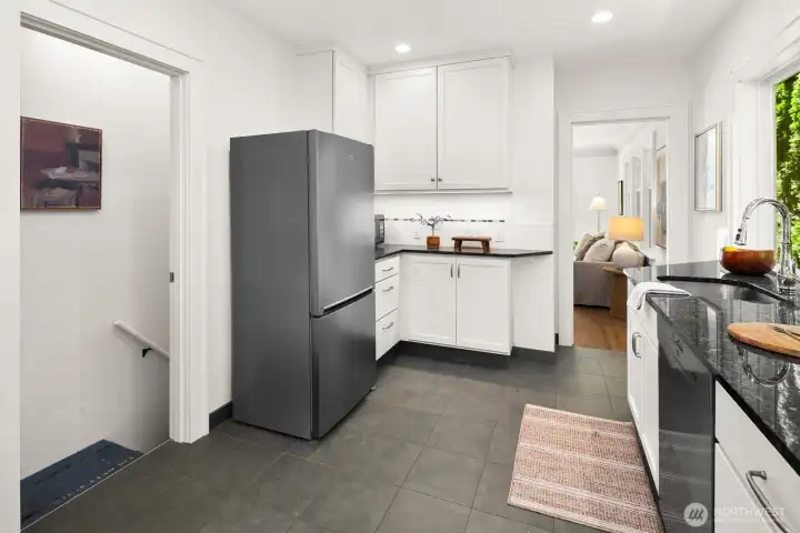 Remodeled kitchen opening to expansive back deck