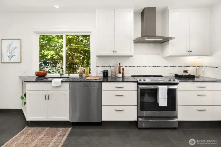 Remodeled kitchen opening to expansive back deck
