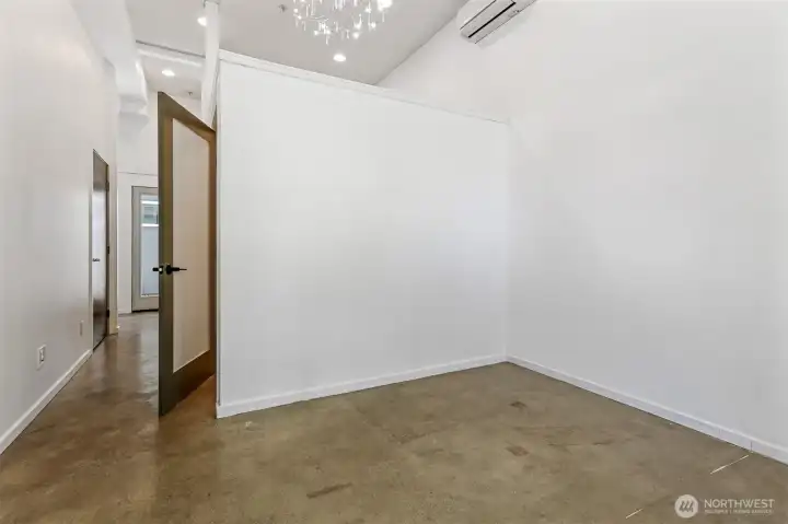 Wall was added to create an additional bedroom. Could be removed to create a 500sqft open space.