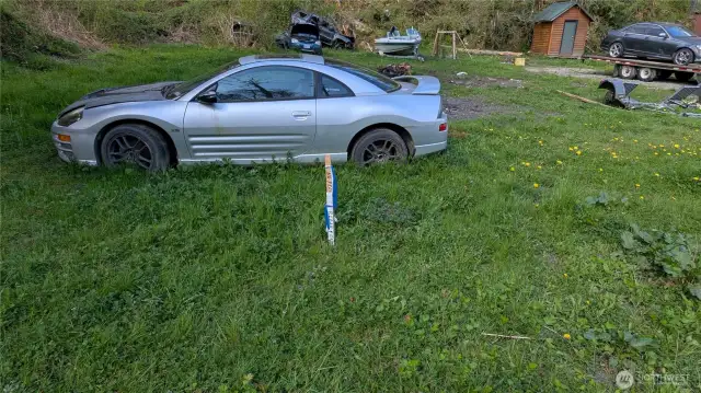 NE Corner NW corner behind car bodies