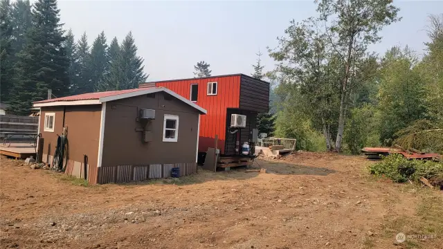 The rear views of the tiny home and bunkhouse.