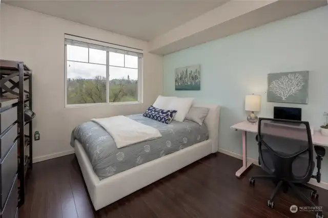 The second bedroom overlooks the private greenbelt & features two closets plus a full bathroom.