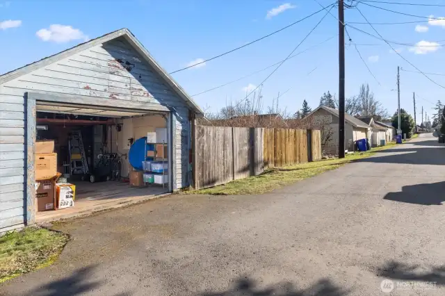 Detached garage has superb alley access.  Adjacent to the garage is a double gate and extra parking pad.  Again, excellent space for a future DADU?