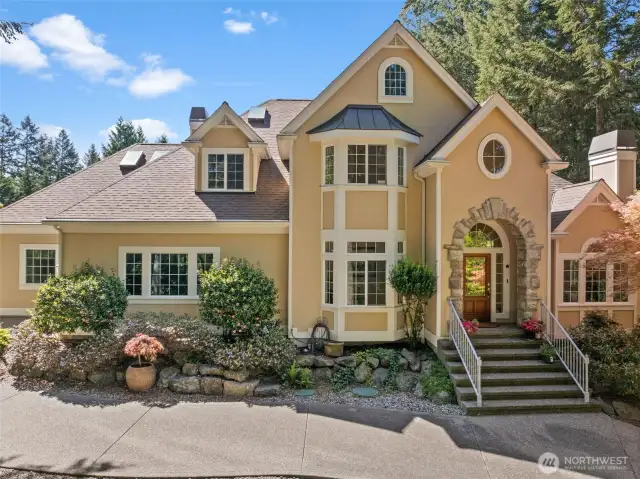 This absolutely stunning home has so much charm with a water view & over an acre of privacy
