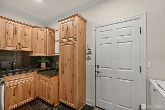 Main floor laundry and mud room with laundry sink
