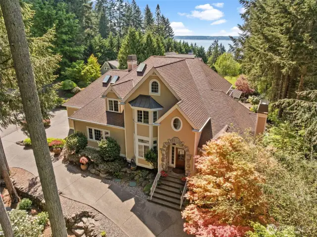 This home sits on 1.4 acres with view of the water and so much privacy with mature landscaping