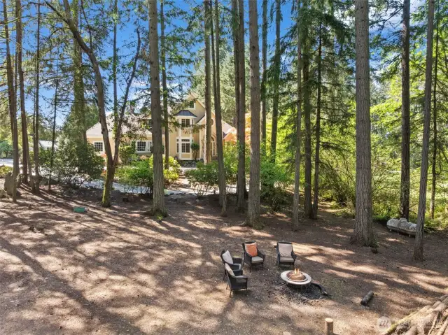 The lot goes all the way to the street & has space for an outdoor firepit, potential 2nd garage
