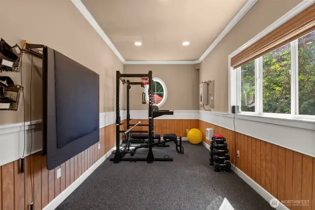 Full exercise room or workshop off garage with electricity
