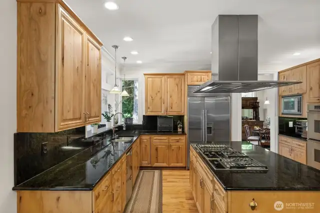 Granite counters, solid wood cabinetry, Wolf Range, Double ovens