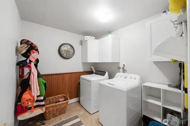 Laundry room with built in cabnets.