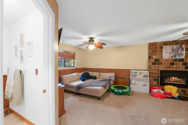 View from hallway of second bathroom and bonus space downstairs.