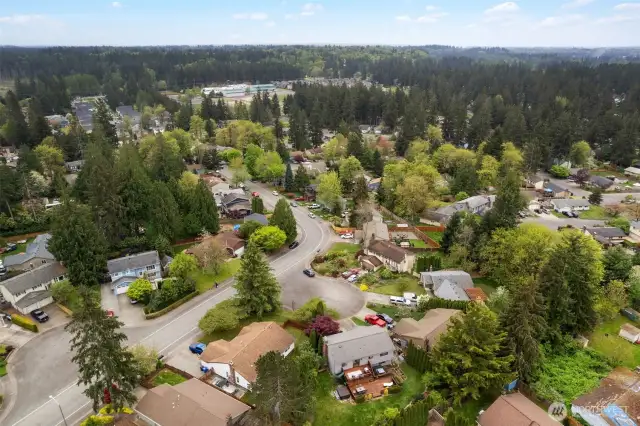 Aerial view of back of home and neighborhood.