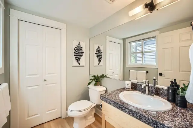 Main floor 1/2 bath with linen closet