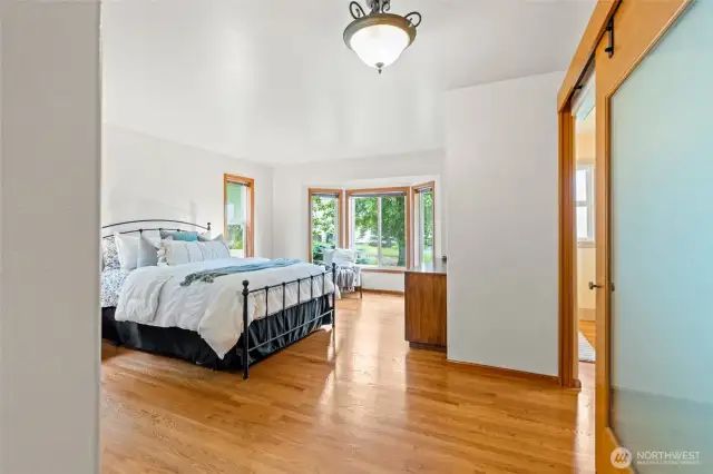 Hardwood continues into primary bedroom