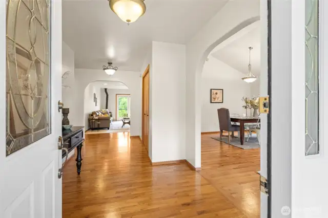 Spacious and inviting entry highlighted by oak hardwood
