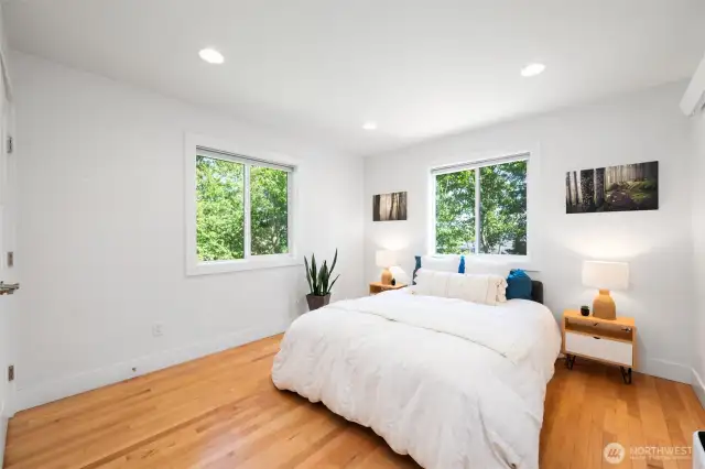 The primary bedroom has filtered water views.