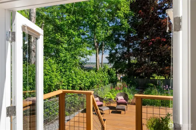 French doors lead out to a sunny deck with filtered water views!