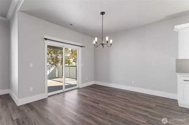 Bright and inviting, the spacious dining area flows seamlessly into the open-concept living space—perfect for entertaining and effortless everyday living