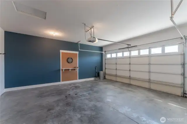 This spacious attached garage is fully finished for a clean, polished look—perfect for parking, storage, or a home workshop